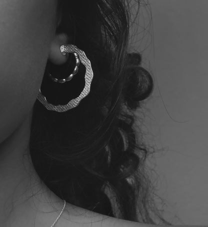 Hoops gold plated silver earrings.